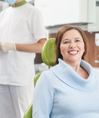 a patient smiling while visiting her dentist