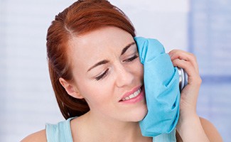 Woman using a cold compress